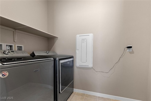 2367 Ridgeline Wash St, Las Vegas, NV 89138 - washroom featuring washer and clothes dryer, baseboards, electric panel, and light tile patterned floors