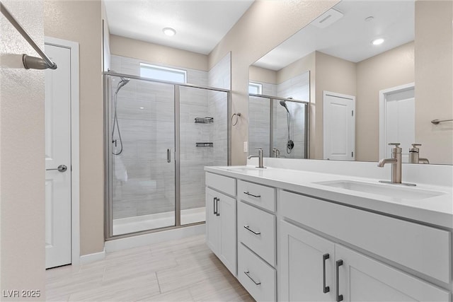 2367 Ridgeline Wash St, Las Vegas, NV 89138 - full bathroom featuring double vanity and a shower stall