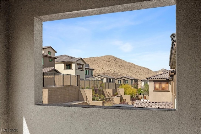 2367 Ridgeline Wash St, Las Vegas, NV 89138 - view of front facade featuring a balcony, stucco siding, a residential view, and a mountain view