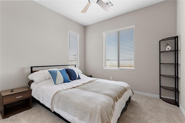 2367 Ridgeline Wash St, Las Vegas, NV 89138 - bedroom with multiple windows, light colored carpet, baseboards, and ceiling fan