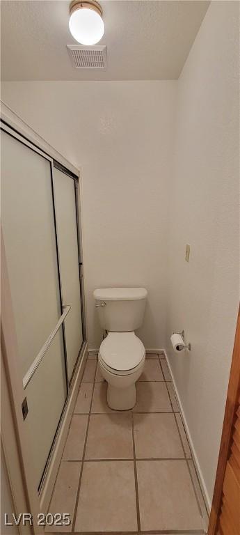 2216 Short Pine Dr, Las Vegas, NV 89108 - bathroom featuring toilet, tile patterned floors, and baseboards