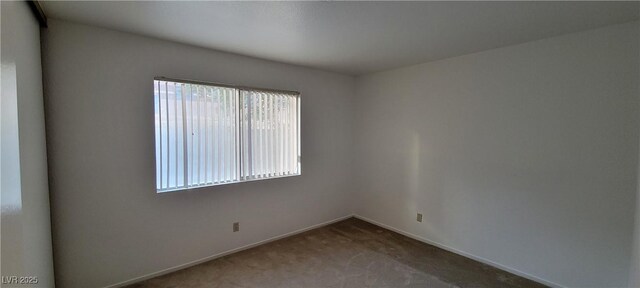 2216 Short Pine Dr, Las Vegas, NV 89108 - carpeted spare room featuring baseboards
