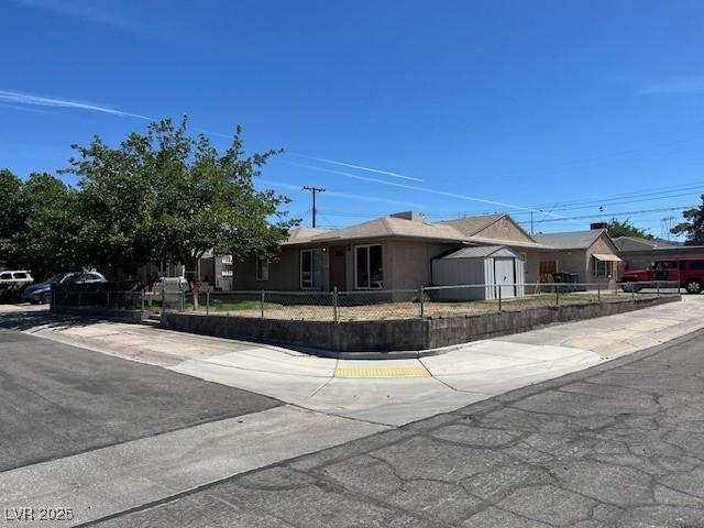 600 Federal St, Henderson, NV 89015 - single story home with a fenced front yard and a storage unit
