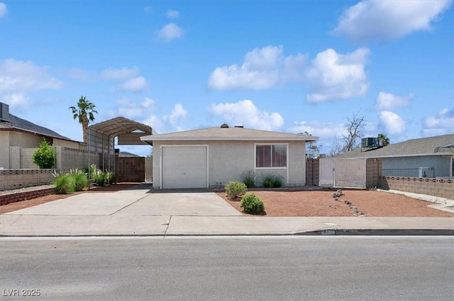 460 Crestway Rd, Henderson, NV 89015 - ranch-style home with a detached carport, a gate, driveway, stucco siding, and an attached garage