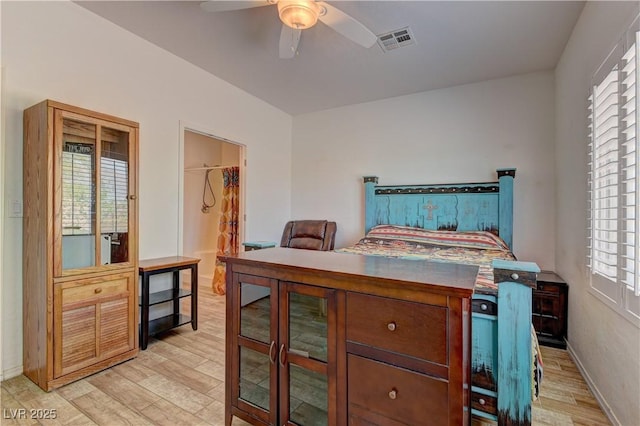2304 Willow Wren Dr, North Las Vegas, NV 89084 - bedroom with light wood-type flooring, baseboards, and a ceiling fan