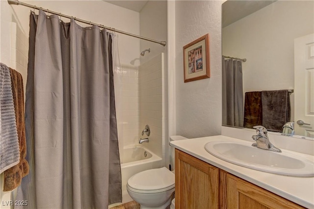 2304 Willow Wren Dr, North Las Vegas, NV 89084 - full bath with vanity, toilet, shower / bath combo with shower curtain, and a textured wall