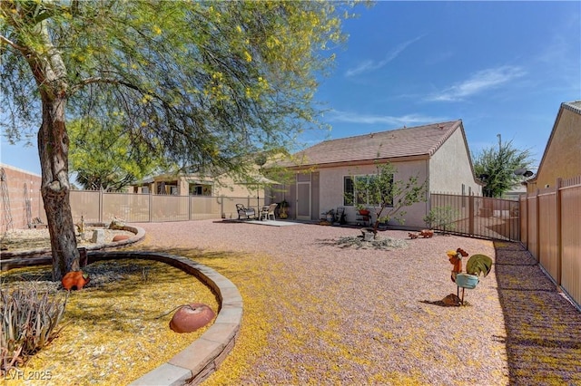 2304 Willow Wren Dr, North Las Vegas, NV 89084 - fenced backyard featuring a patio