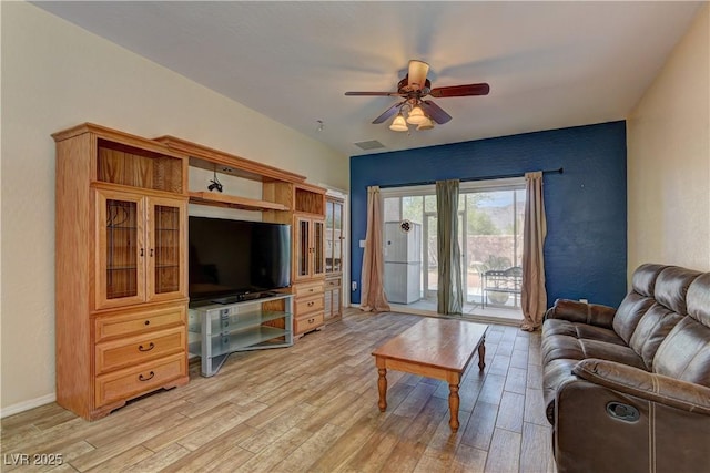 2304 Willow Wren Dr, North Las Vegas, NV 89084 - living room featuring light wood-type flooring, ceiling fan, and baseboards