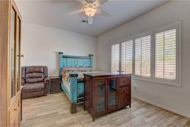2304 Willow Wren Dr, North Las Vegas, NV 89084 - bedroom featuring light wood finished floors, multiple windows, a ceiling fan, and baseboards