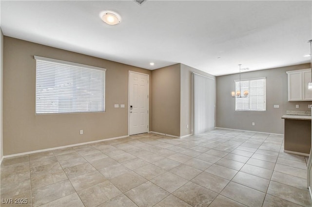 8486 Insignia Ave Unit 101, Las Vegas, NV 89178 - unfurnished living room with a chandelier, light tile patterned floors, baseboards, and recessed lighting
