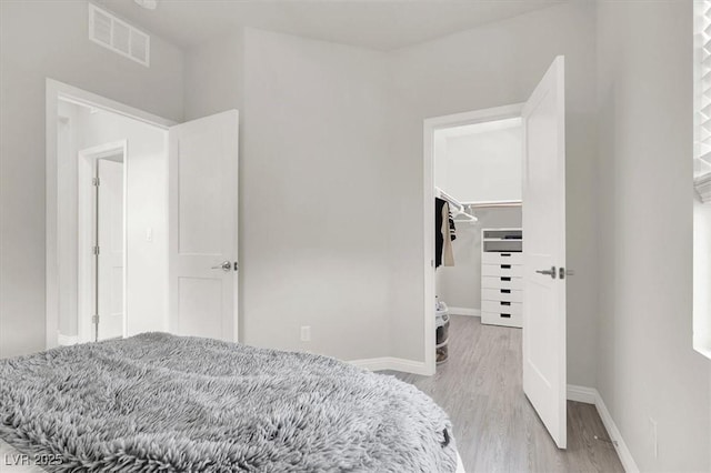 11856 Barona Mesa Ave, Las Vegas, NV 89138 - bedroom featuring light wood-type flooring, a walk in closet, and a closet