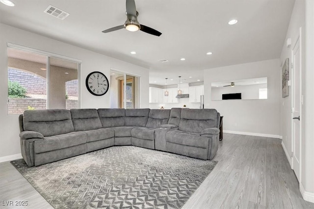 11856 Barona Mesa Ave, Las Vegas, NV 89138 - living area with ceiling fan, wood finished floors, healthy amount of natural light, and recessed lighting