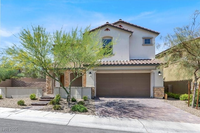 11856 Barona Mesa Ave, Las Vegas, NV 89138 - mediterranean / spanish-style house with stucco siding, a tile roof, a garage, and decorative driveway