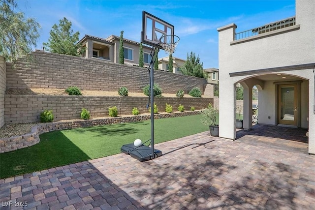 11856 Barona Mesa Ave, Las Vegas, NV 89138 - fenced backyard with a patio area