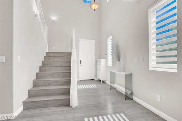 11856 Barona Mesa Ave, Las Vegas, NV 89138 - staircase with healthy amount of natural light, wood finished floors, and a high ceiling