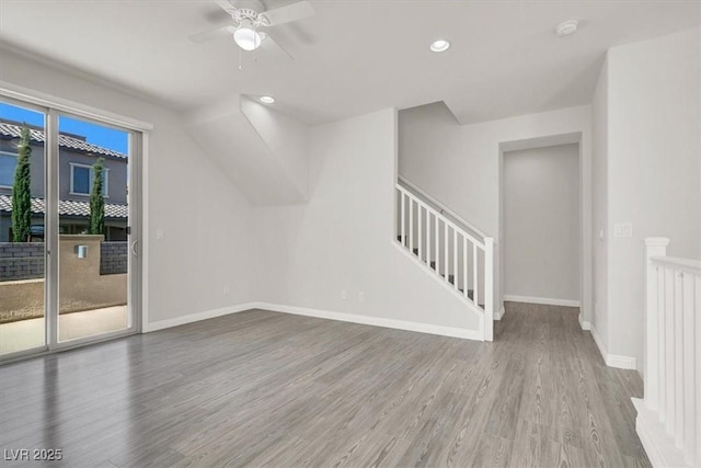 11856 Barona Mesa Ave, Las Vegas, NV 89138 - empty room with wood finished floors, a smoke detector, ceiling fan, recessed lighting, and stairs