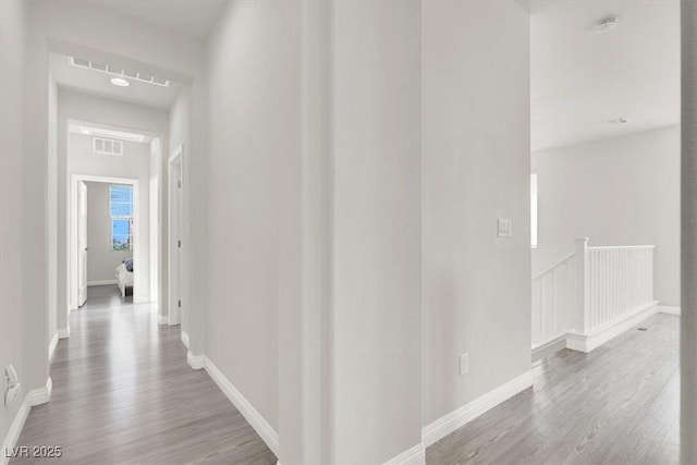 11856 Barona Mesa Ave, Las Vegas, NV 89138 - hallway with wood finished floors and an upstairs landing
