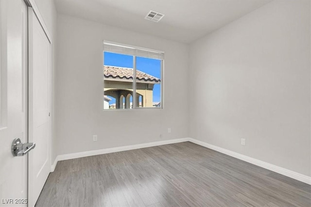 11856 Barona Mesa Ave, Las Vegas, NV 89138 - unfurnished bedroom with wood finished floors and a closet