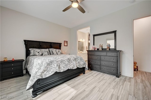 505 Sterling Falls Ave, Henderson, NV 89011 - bedroom with light wood finished floors, a ceiling fan, ensuite bathroom, and baseboards