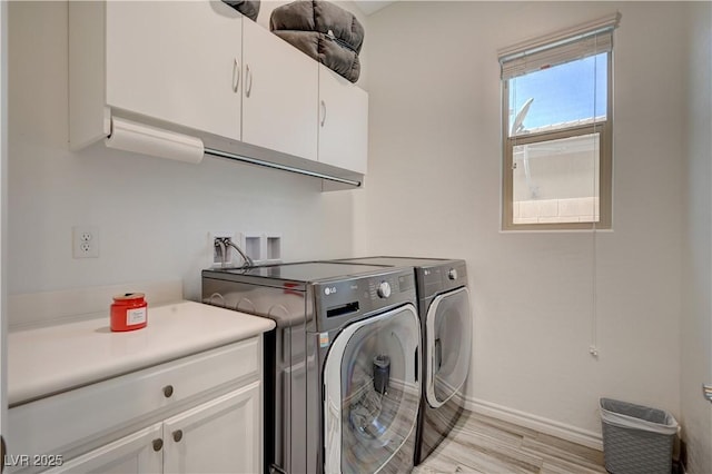 505 Sterling Falls Ave, Henderson, NV 89011 - washroom featuring cabinet space, washer and dryer, light wood finished floors, and baseboards