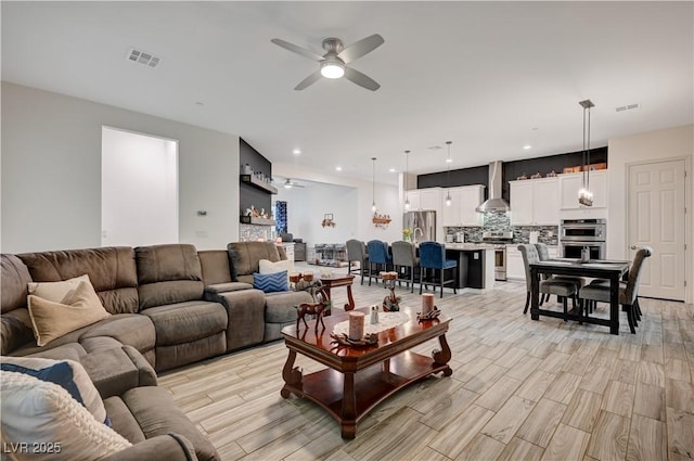 505 Sterling Falls Ave, Henderson, NV 89011 - living room featuring ceiling fan and light wood finished floors