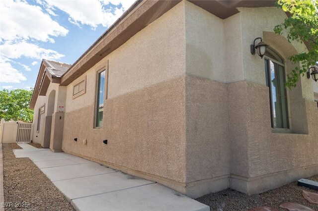 2021 Pelican Sky Beach Ave, North Las Vegas, NV 89081 - view of property exterior featuring stucco siding and a gate