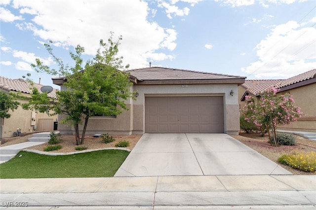 2021 Pelican Sky Beach Ave, North Las Vegas, NV 89081 - view of front facade featuring a garage, driveway, stucco siding, and a tile roof