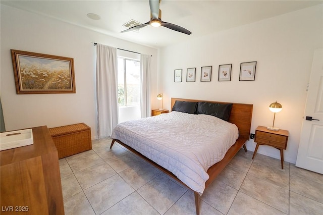2021 Pelican Sky Beach Ave, North Las Vegas, NV 89081 - bedroom with light tile patterned floors and a ceiling fan