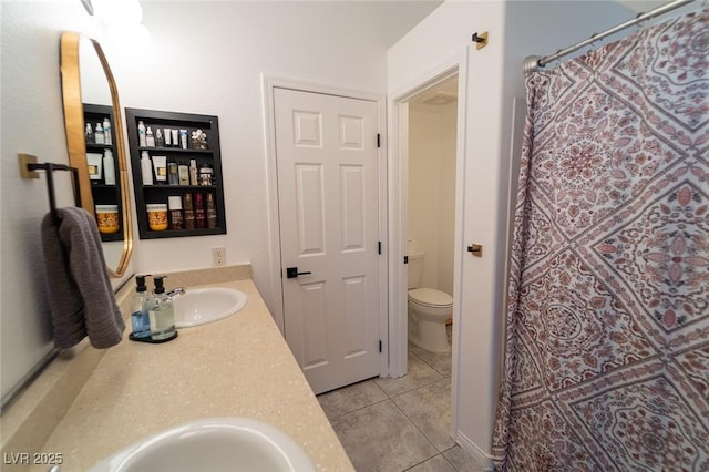 2021 Pelican Sky Beach Ave, North Las Vegas, NV 89081 - bathroom with double vanity, toilet, and tile patterned floors