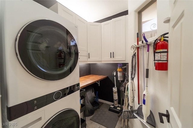 2021 Pelican Sky Beach Ave, North Las Vegas, NV 89081 - washroom with stacked washer and clothes dryer and cabinet space