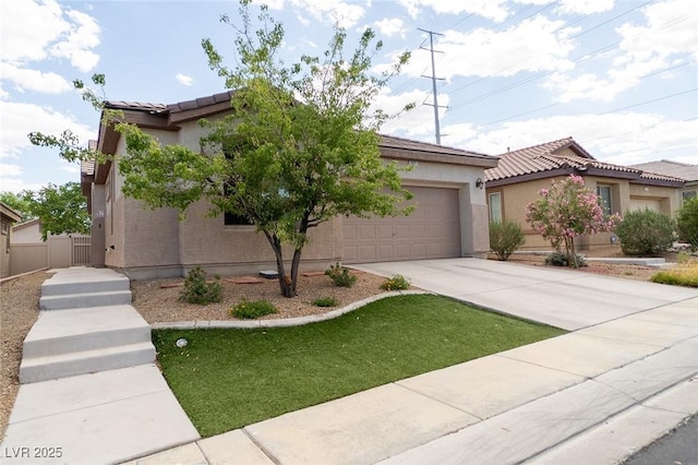 2021 Pelican Sky Beach Ave, North Las Vegas, NV 89081 - view of front facade with a tiled roof, driveway, a garage, and stucco siding