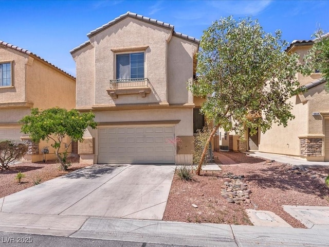 3040 Balcones Fault Ave, North Las Vegas, NV 89081 - view of front of property with an attached garage, stucco siding, driveway, and a tiled roof