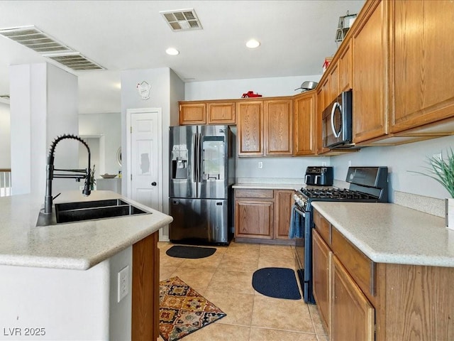3040 Balcones Fault Ave, North Las Vegas, NV 89081 - kitchen featuring appliances with stainless steel finishes, brown cabinetry, a sink, light countertops, and recessed lighting