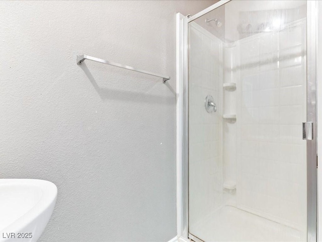 3040 Balcones Fault Ave, North Las Vegas, NV 89081 - full bath with a stall shower and a textured wall