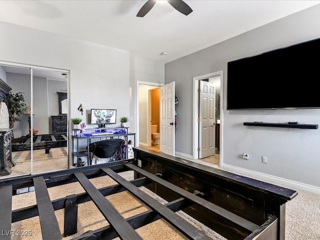 3040 Balcones Fault Ave, North Las Vegas, NV 89081 - bedroom with baseboards, ensuite bath, and ceiling fan