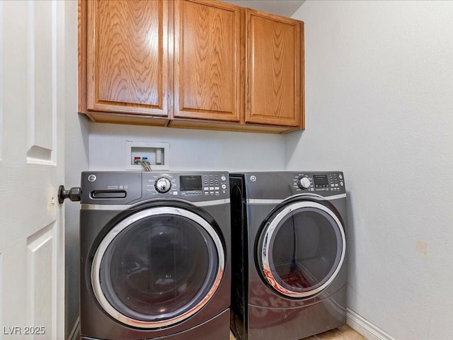 3040 Balcones Fault Ave, North Las Vegas, NV 89081 - laundry area featuring cabinet space, washing machine and clothes dryer, and baseboards