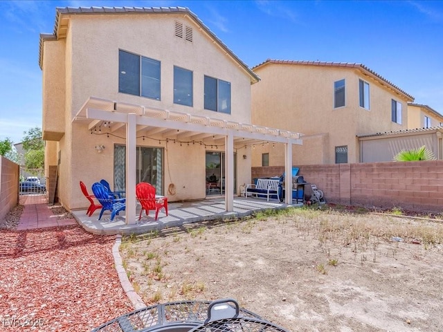3040 Balcones Fault Ave, North Las Vegas, NV 89081 - back of house featuring stucco siding, a fenced backyard, a pergola, and a patio area