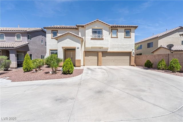 11134 Casala Ct, Las Vegas, NV 89141 - mediterranean / spanish house with an attached garage, concrete driveway, stucco siding, and a tiled roof