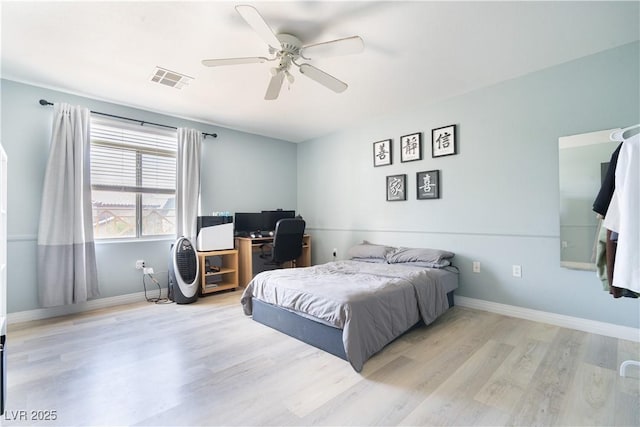 11134 Casala Ct, Las Vegas, NV 89141 - bedroom with wood finished floors, baseboards, a desk, and a ceiling fan