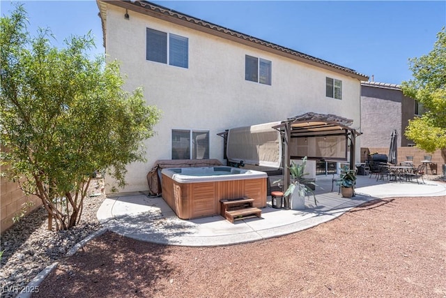 11134 Casala Ct, Las Vegas, NV 89141 - rear view of house with a hot tub, stucco siding, and a patio area