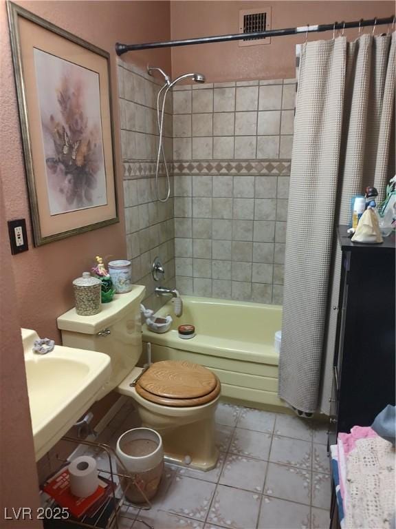 4727 Conrad St, Las Vegas, NV 89121 - full bath with shower / tub combo with curtain, tile patterned flooring, and toilet