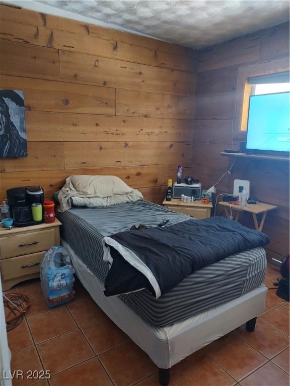 4727 Conrad St, Las Vegas, NV 89121 - tiled bedroom with wood walls