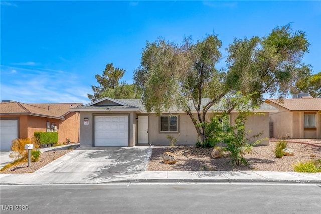 5257 Sunbury Ave, Las Vegas, NV 89122 - ranch-style home with an attached garage, driveway, and stucco siding