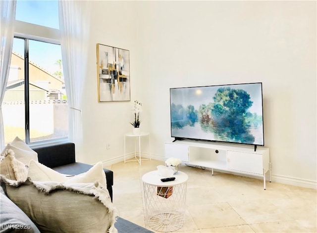 5984 Emerald Canyon Dr, Las Vegas, NV 89142 - living area with baseboards and a high ceiling
