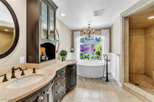 108 Quail Run Rd, Henderson, NV 89014 - bathroom with double vanity, tile patterned floors, a soaking tub, a chandelier, and tiled shower