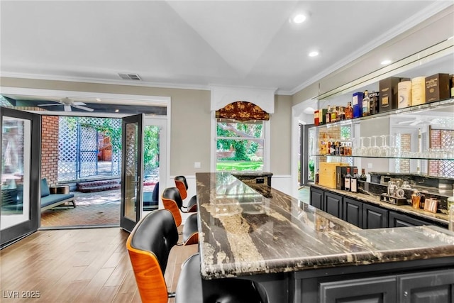 108 Quail Run Rd, Henderson, NV 89014 - indoor wet bar with crown molding, a ceiling fan, recessed lighting, and wood finished floors
