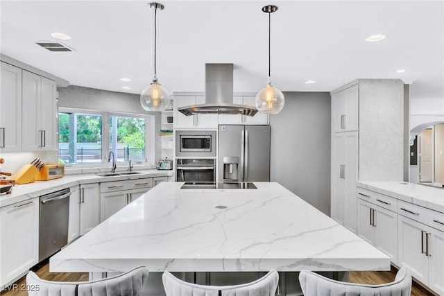 108 Quail Run Rd, Henderson, NV 89014 - kitchen featuring stainless steel appliances, island range hood, a sink, recessed lighting, and a center island