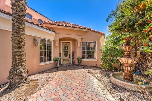 27 Via Paradiso St, Henderson, NV 89011 - property entrance featuring stucco siding and a tile roof