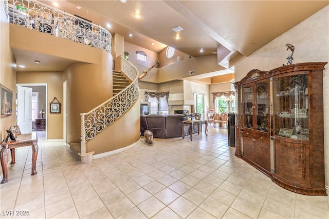 27 Via Paradiso St, Henderson, NV 89011 - foyer entrance with high vaulted ceiling, stairway, light tile patterned floors, recessed lighting, and baseboards