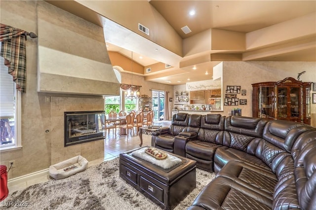27 Via Paradiso St, Henderson, NV 89011 - living room with tile patterned floors, high vaulted ceiling, recessed lighting, and a multi sided fireplace